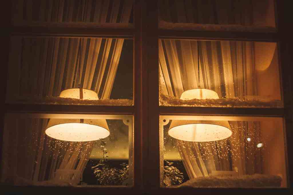 Warm light through a window at night, quiet interior atmosphere