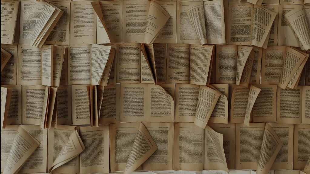 A captivating display of old open books arranged vertically, creating a vintage aesthetic.