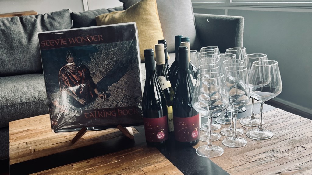 Steveie Wonder Album with various bottles of wine.