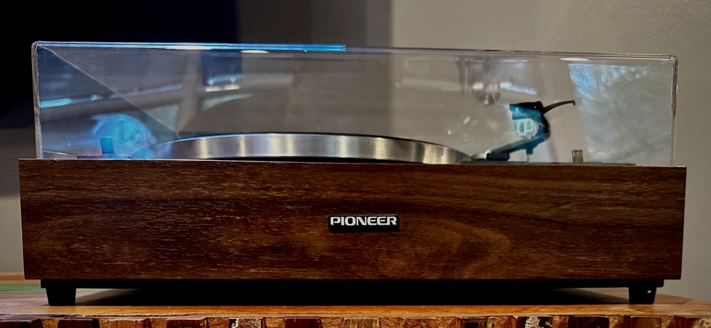 Pioneer PL-12D turntable front view with wood plinth and dust cover