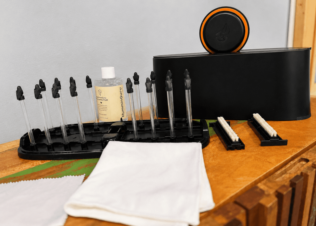 HumminGuru EZ Record Washer kit with drying rack, cleaning fluid, goat-hair brushes, microfiber cloths, and label clamp laid out before first use.