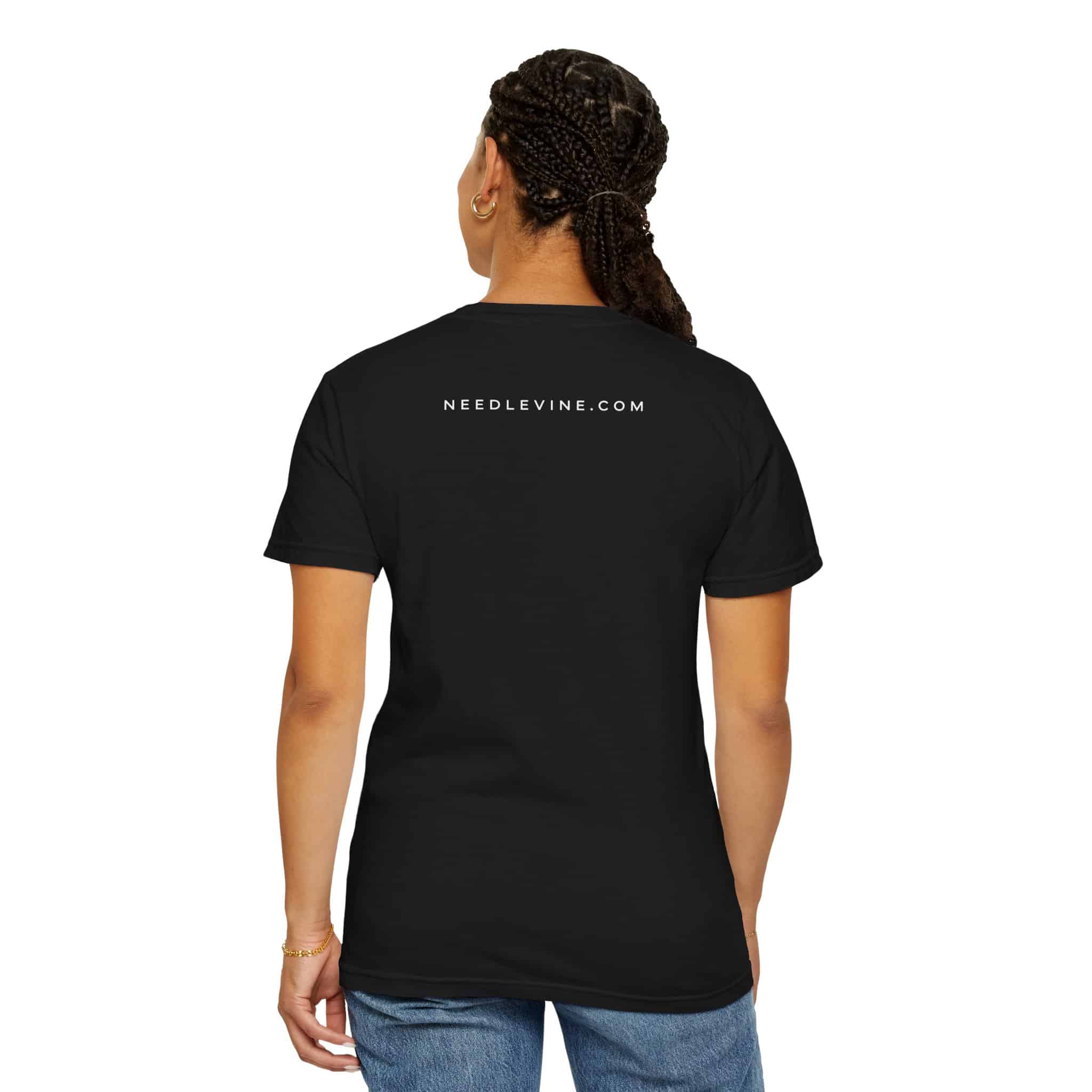 Model wearing black Needle & Vine Logo Tee showing NEEDLEVINE.COM on back