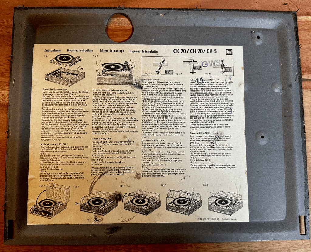 Underside of the original Dual 1219 wood plinth showing its cabinet construction and mounting structure